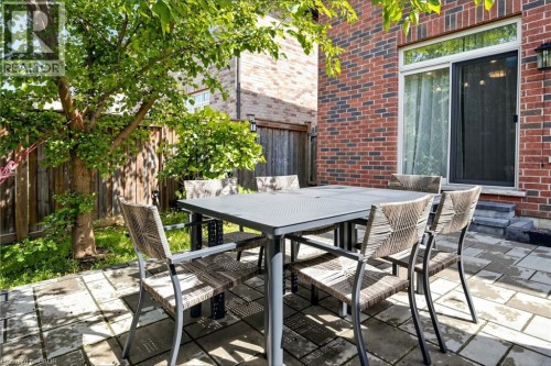 Brick exterior with a sliding glass door - 173 Raymond Road, Ancaster, ON 