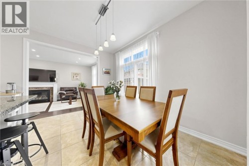 Dining area with tile flooring and track lighting - 173 Raymond Road, Ancaster, ON 