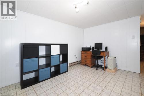 White paneled walls and a white acoustic tile ceiling - 219 Foxhunt Road, Waterloo, ON 