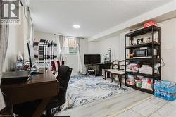 Recessed ceiling lighting, light wood-finish flooring, and a window with blinds - 