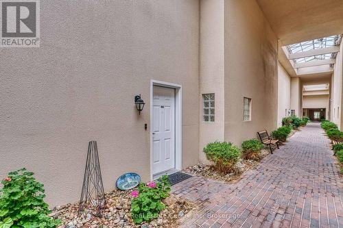 Door to covered atrium - 102 - 760 Woodhill Drive, Centre Wellington (Fergus), ON 