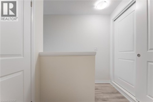 Recessed ceiling light, paneled interior doors, light wood-finish flooring, and light wall finishes - 25 Urbane Boulevard, Kitchener, ON 
