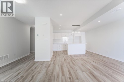 Open-concept layout with wood-finish flooring - 25 Urbane Boulevard, Kitchener, ON 