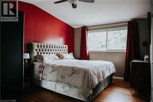 Wood-finish flooring with a ceiling fan and a window - 1 Vera Court, Hamilton, ON 