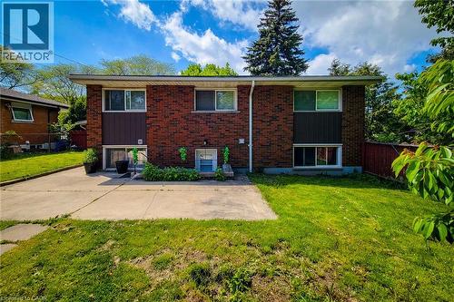 Brick exterior with contrasting vertical siding panels - 1 Vera Court, Hamilton, ON 