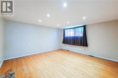 Recessed ceiling lighting, wood-finish flooring, and a window with blinds - 1 Vera Court, Hamilton, ON 