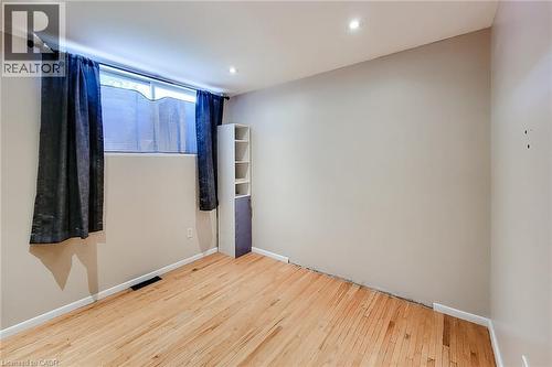 Wood-finish flooring with neutral wall tones and recessed lighting - 1 Vera Court, Hamilton, ON 