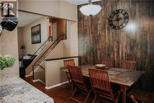 Wood-finish accent wall with a flush-mount light fixture - 1 Vera Court, Hamilton, ON 