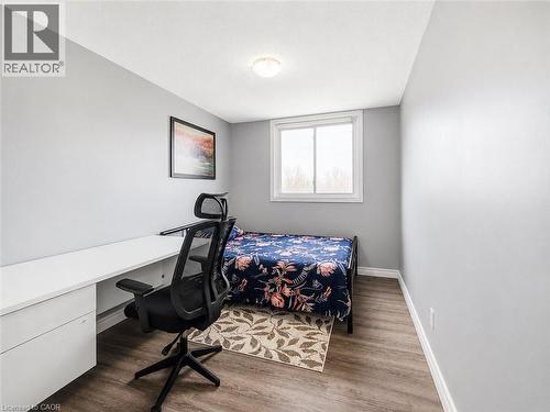 Neutral wall color with wood-finish flooring - 4 Avalon Place Unit# 303, Kitchener, ON 