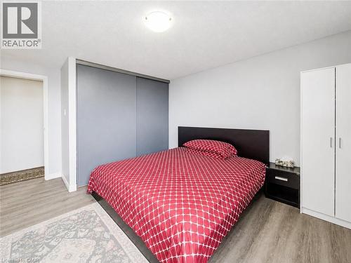 Wood-finish flooring throughout the space - 4 Avalon Place Unit# 303, Kitchener, ON 
