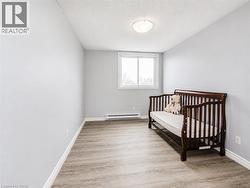 Neutral wall color, wood-finish flooring, and a window for natural light - 