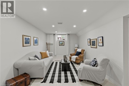 Recessed ceiling lighting, light gray wall finishes, light-toned flooring, and a window with white blinds - 87 Monte Drive, Hamilton, ON 