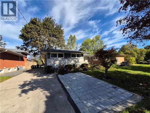 Paved driveway leading to a stone paver patio - 11 Duncairn Avenue, Kitchener, ON 