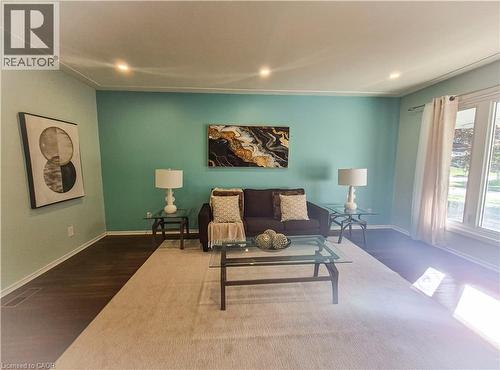 Recessed ceiling lighting, crown molding, wood-finish flooring, and large windows - 11 Duncairn Avenue, Kitchener, ON 