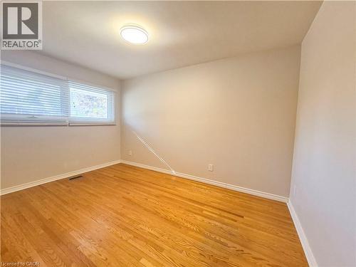Hardwood flooring, natural light through window, recessed ceiling light fixture, neutral wall finishes - 11 Duncairn Avenue, Kitchener, ON 