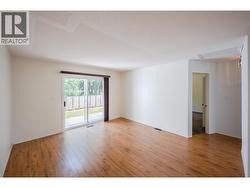 Living room & doorway to primary bedroom - 