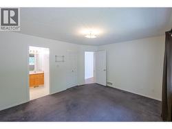 Primary bedroom with 2-piece ensuite & walk-in closet - 