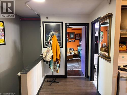 Wood-finish flooring with dark trim details - 12 Bridgeport Road E Unit# 18, Waterloo, ON 