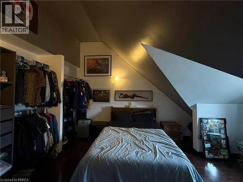 Wood-finish flooring with an angled ceiling design - 12 Bridgeport Road E Unit# 18, Waterloo, ON 