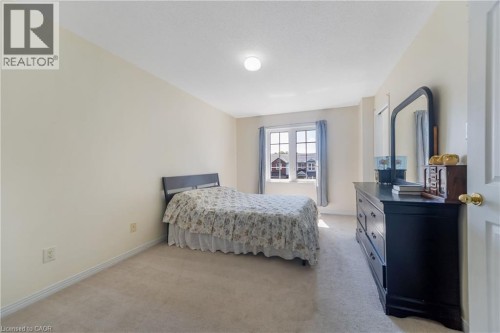 Neutral-toned carpeting paired with light-colored walls - 82 Milner Downs Crescent, Ottawa, ON 