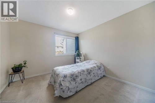 Wall-to-wall carpeting and a single window with white trim - 82 Milner Downs Crescent, Ottawa, ON 