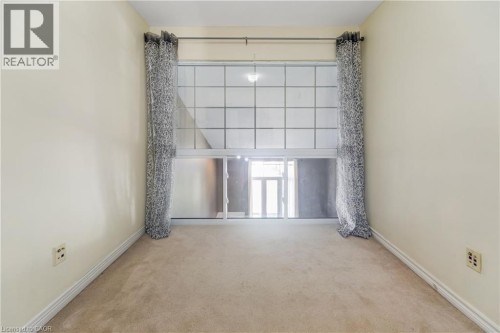 Expansive window featuring grid-patterned panes - 82 Milner Downs Crescent, Ottawa, ON 