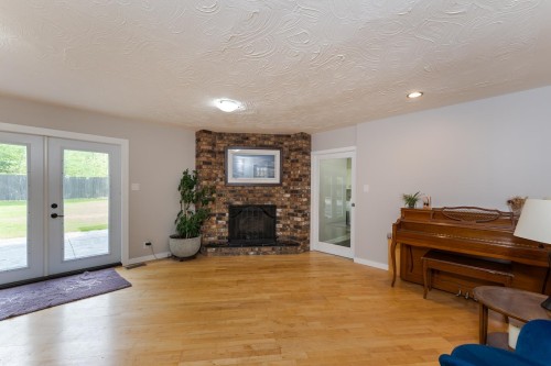 8195 Prince Edward Place, Prince George, BC - Indoor Photo Showing Living Room With Fireplace