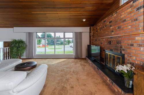 8195 Prince Edward Place, Prince George, BC - Indoor Photo Showing Other Room With Fireplace