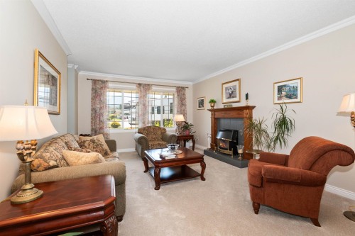 6755 Henry Street, Chilliwack, BC - Indoor Photo Showing Living Room With Fireplace