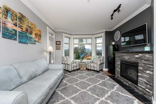 204-46021 Second Avenue, Chilliwack, BC - Indoor Photo Showing Living Room With Fireplace