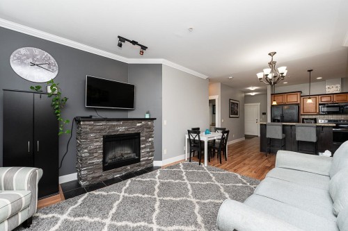 204-46021 Second Avenue, Chilliwack, BC - Indoor Photo Showing Living Room With Fireplace