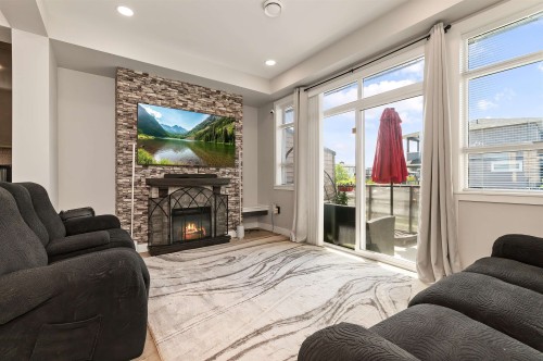 107-8413 Midtown Way, Chilliwack, BC - Indoor Photo Showing Living Room With Fireplace