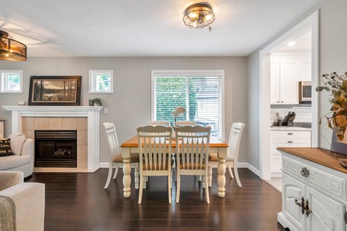 24-20761 Telegraph Trail, Langley, BC - Indoor Photo Showing Dining Room With Fireplace