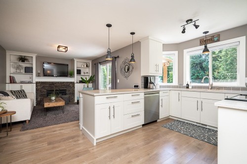 7988 Melburn Drive, Mission, BC - Indoor Photo Showing Kitchen With Fireplace