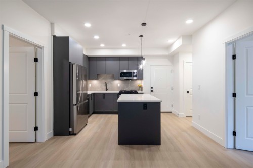 310-3480 146A, Surrey, BC - Indoor Photo Showing Kitchen With Stainless Steel Kitchen With Upgraded Kitchen