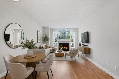 210-2963 Nelson Place, Abbotsford, BC - Indoor Photo Showing Dining Room With Fireplace
