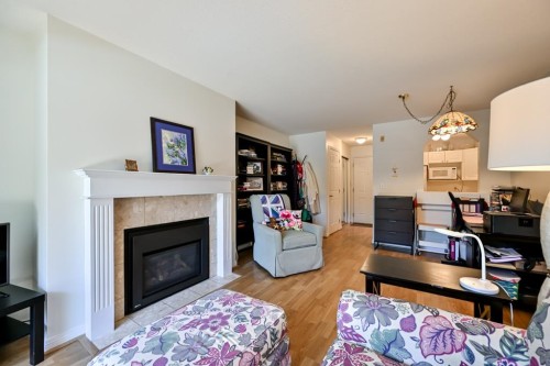 101-20727 Douglas Crescent, Langley, BC - Indoor Photo Showing Living Room With Fireplace