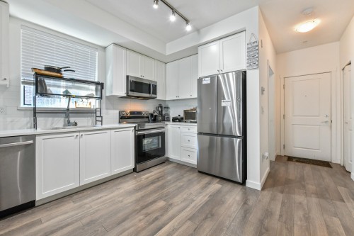 306-15848 Fraser Highway, Surrey, BC - Indoor Photo Showing Kitchen With Stainless Steel Kitchen