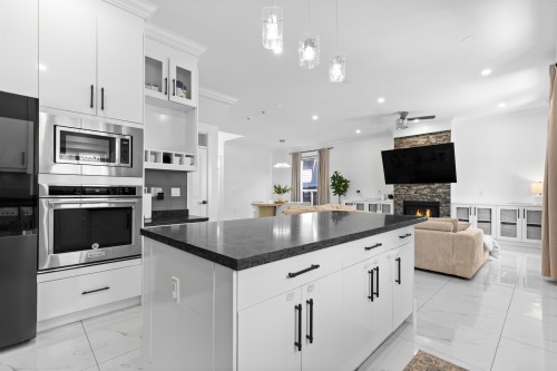 18080 67 Avenue, Surrey, BC - Indoor Photo Showing Kitchen With Fireplace With Upgraded Kitchen