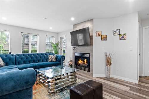 105-12125 75A Avenue, Surrey, BC - Indoor Photo Showing Living Room With Fireplace