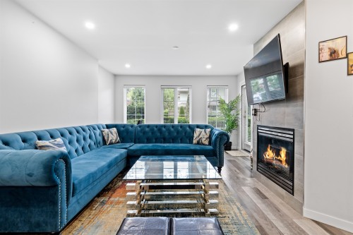 105-12125 75A Avenue, Surrey, BC - Indoor Photo Showing Living Room With Fireplace