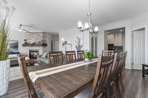 2764 St Moritz Way, Abbotsford, BC - Indoor Photo Showing Dining Room With Fireplace