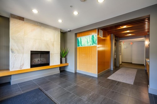 516-9319 University Crescent, Burnaby, BC - Indoor Photo Showing Other Room With Fireplace