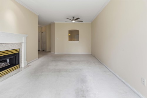 226-3098 Guildford Way, Coquitlam, BC - Indoor With Fireplace
