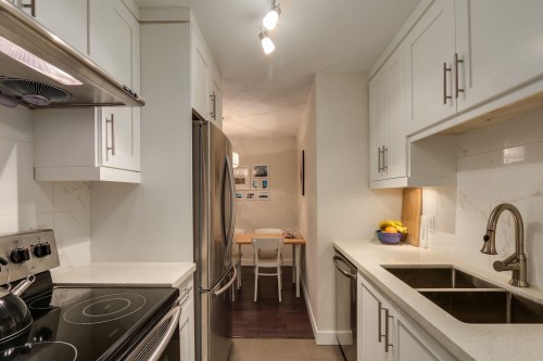 203-1611 3Rd Avenue E, Vancouver, BC - Indoor Photo Showing Kitchen With Double Sink