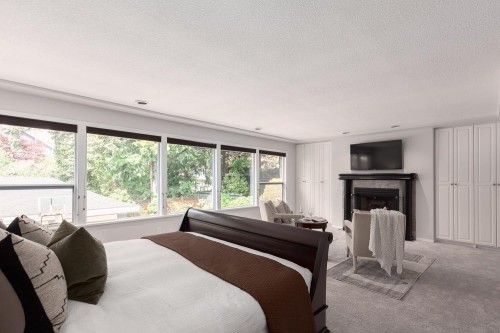 3557 36Th Avenue W, Vancouver, BC - Indoor Photo Showing Bedroom With Fireplace