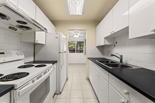 108-1420 8Th Avenue E, Vancouver, BC - Indoor Photo Showing Kitchen With Double Sink
