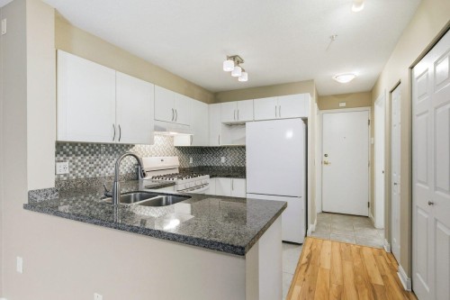 209-688 16Th Avenue E, Vancouver, BC - Indoor Photo Showing Kitchen With Double Sink