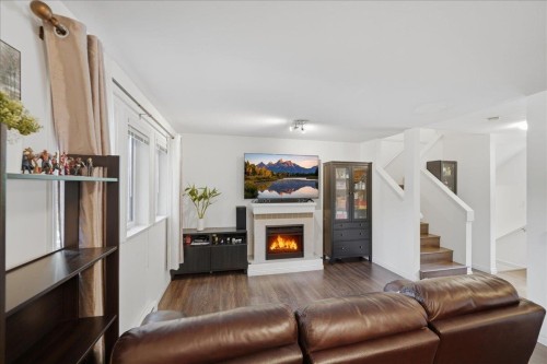 1-7128 17Th Avenue, Burnaby, BC - Indoor Photo Showing Living Room With Fireplace