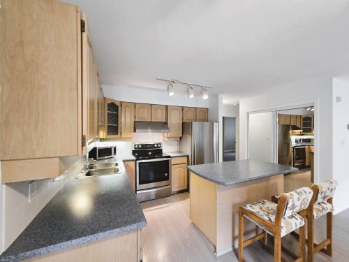 101-5565 Barker Avenue, Burnaby, BC - Indoor Photo Showing Kitchen With Double Sink